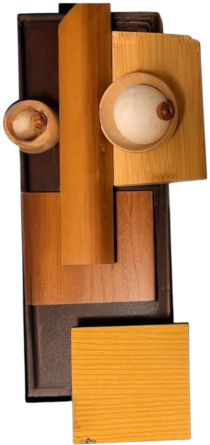 Guardian No. 8, The Architect: a Cubist mask of overlapping wood planes with two mismatched round eyes